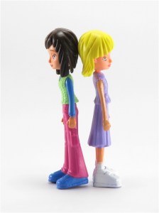 Two teenage dolls back to back isolated on white background