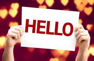 Hello card with heart bokeh background