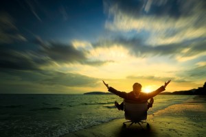 Relaxing businessman sitting on beach, Success in business concept